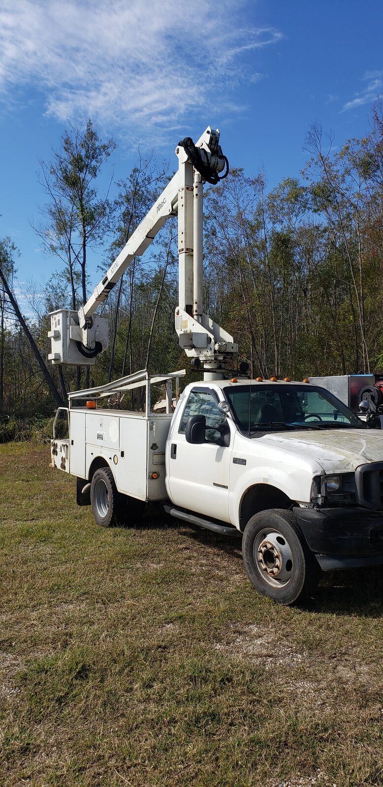 Utility truck with an aerial boom lift